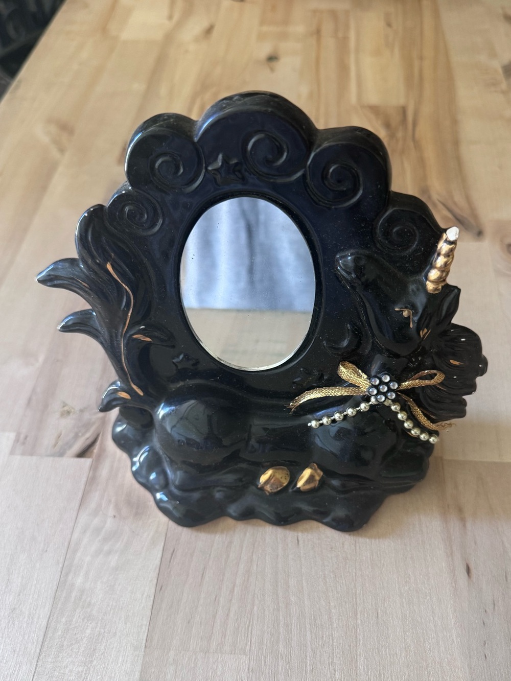 Black ceramic unicorn mirror